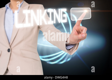 Businesswomans finger touching linking button Stock Photo
