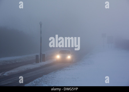 Winter driving in freezing fog on a country road in Yorkshire in the United Kingdom. Stock Photo