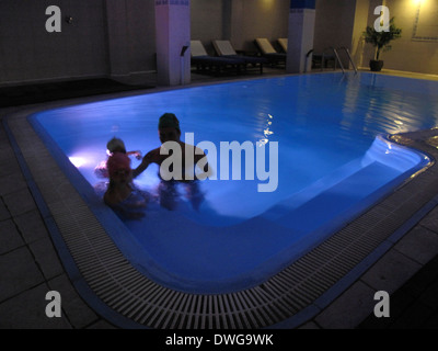 Sol Vielha Hotel. Inside the swimming pool. Landscape near the tunnel of Vielha, road N 230, Vielha e Mijaran, Viella, Val d'Aran, Aran Valley, Pyrenees, Lleida province. View of mountains, town centre, river and Vielha small lake Stock Photo