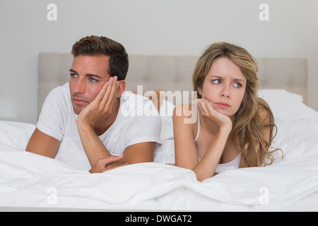 Couple not talking after an argument in bed Stock Photo