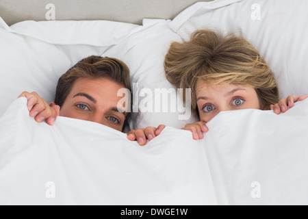 Relaxed young couple together in bed Stock Photo