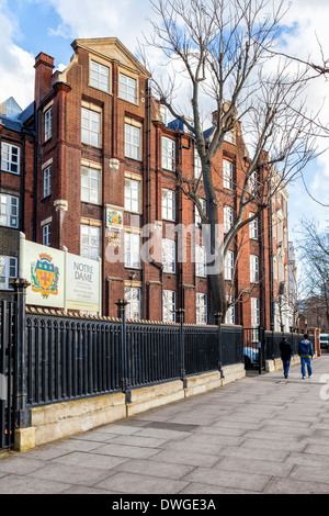 Notre Dame Roman Catholic convent and Girls High school gabled brick building and sign with crest - Southwark, South London, SE1 Stock Photo