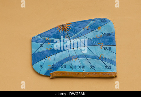 An ornamental sundial on a wall in a street of Lastra a Signa, near Florence, Tuscany, Italy, Europe Stock Photo