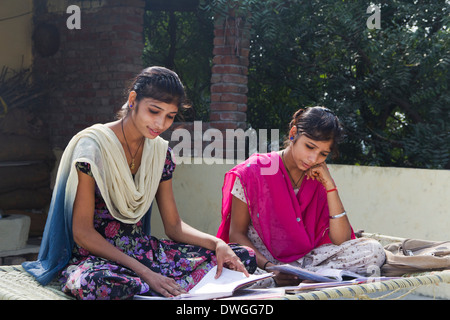 Indian rural student reading at home Stock Photo