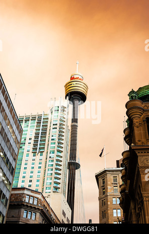 The AMP Tower in Sydney with smoke drifting in from neighbouring bush fires turning the clouds an eerie orange. Stock Photo