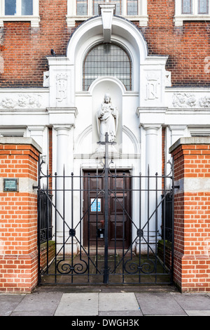 Notre Dame Roman Catholic convent and Girls High school entrance, cross and wrought iron gate - Southwark, South London, SE1 Stock Photo