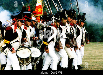 French Napoleonic Troops marching in battle 1815, as deployed at Battle of Waterloo, historical re-enactment soldier soldiers uniform uniforms drums musket smoke infantry Stock Photo