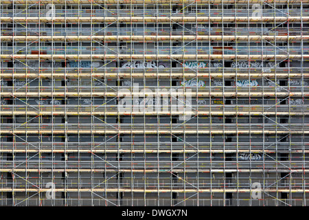 Scaffolding erected around one large empty Heygate Estate high rise social housing blocks preparing for demolition Southwark South London England UK Stock Photo