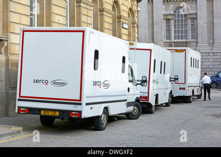 Three joint venture white Serco (outsourcing business) & Wincanton prisoner vans parked outside rear of City of London Magistrates Court England UK Stock Photo