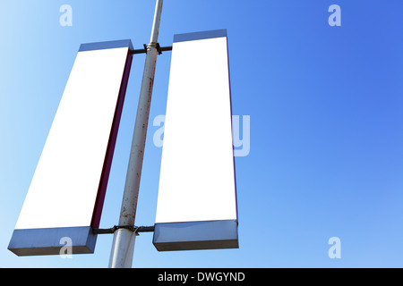 Two blank signs on the post, put your own text or image here Stock Photo