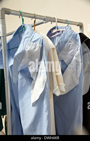 Blue pants after washing hanging on clothes line. Stock Photo
