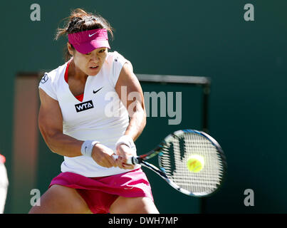 08 March, 2014: Na Li of China returns a shot against Jie Zheng of China during the BNP Paribas Open at Indian Wells Tennis Garden in Indian Wells CA. Stock Photo