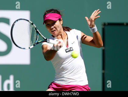 08 March, 2014: Na Li of China returns a shot against Jie Zheng of China during the BNP Paribas Open at Indian Wells Tennis Garden in Indian Wells CA. Stock Photo