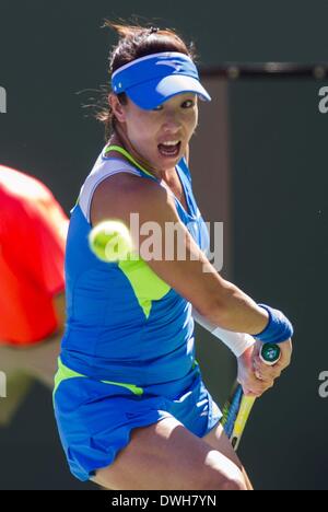 Los Angeles, California, USA. 8th Mar, 2014. Jie Zheng of China returns a shot against Na Li of China during a second -round match at the BNP Paribas Open tennis tournament on Saturday, March 8, 2014, in Indian Wells, California. Credit:  Ringo Chiu/ZUMAPRESS.com/Alamy Live News Stock Photo