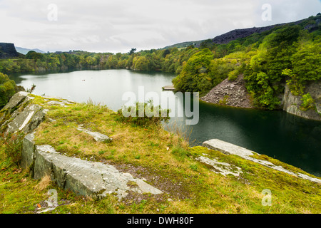 Looking across the disused Dorothea Slate Quarry, Nantlle, Gwynedd, Wales, United Kingdom. Flooded with water. Stock Photo