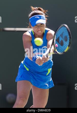 Los Angeles, California, USA. 8th Mar, 2014. Jie Zheng of China returns a shot against Na Li of China during a second -round match at the BNP Paribas Open tennis tournament on Saturday, March 8, 2014, in Indian Wells, California. Credit:  Ringo Chiu/ZUMAPRESS.com/Alamy Live News Stock Photo