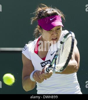 Los Angeles, California, USA. 8th Mar, 2014. Na Li of China returns a shot against Jie Zheng of China during a second -round match at the BNP Paribas Open tennis tournament on Saturday, March 8, 2014, in Indian Wells, California. Credit:  Ringo Chiu/ZUMAPRESS.com/Alamy Live News Stock Photo