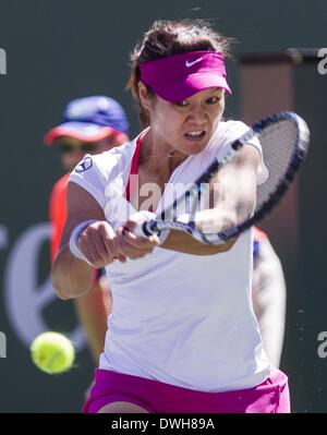 Los Angeles, California, USA. 8th Mar, 2014. Na Li of China returns a shot against Jie Zheng of China during a second -round match at the BNP Paribas Open tennis tournament on Saturday, March 8, 2014, in Indian Wells, California. Credit:  Ringo Chiu/ZUMAPRESS.com/Alamy Live News Stock Photo