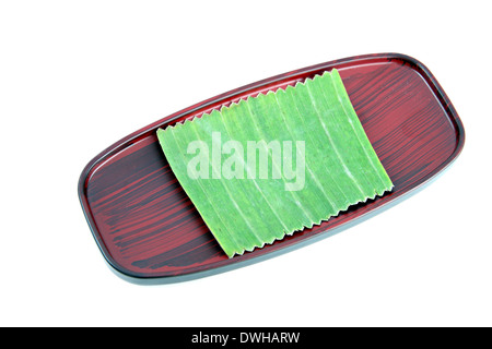 Banana leaf background on dish. Stock Photo