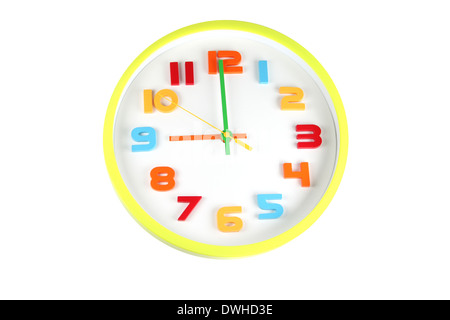 Colorful clock in telling time of nine o'clock on white background. Stock Photo