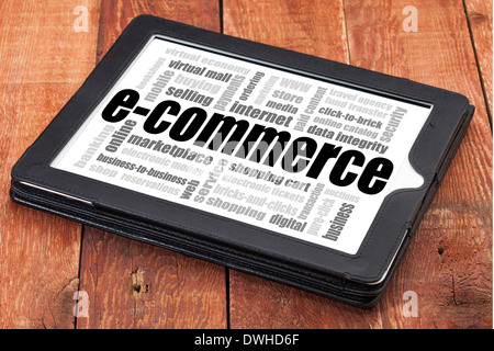 e-commerce word cloud - a digital tablet on a rustic wooden table Stock Photo
