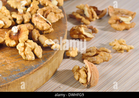 Dried walnuts on wooden table Stock Photo