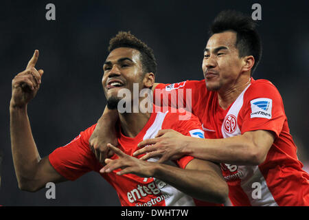 Mainz, Germany. 09th Mar, 2014. Mainz's Maxim Choupo-Moting (L) celebrates after his 1-1 goal with Zdenek Pospech (R) and Joo-Ho Park during the German Bundesliga match between FSV Mainz 05 and Hertha BSC at Coface Arena in Mainz, Germany, 09 March 2014. Photo: FREDRIK VON ERICHSEN (ATTENTION: Due to the accreditation guidelines, the DFL only permits the publication and utilisation of up to 15 pictures per match on the internet and in online media during the match.)/dpa/Alamy Live News Stock Photo