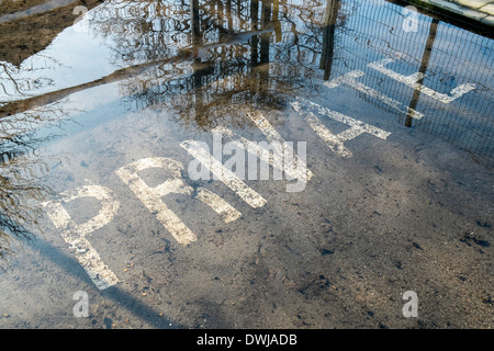 Floodwater in Chalfont St Giles public car park Bucks UK Stock Photo