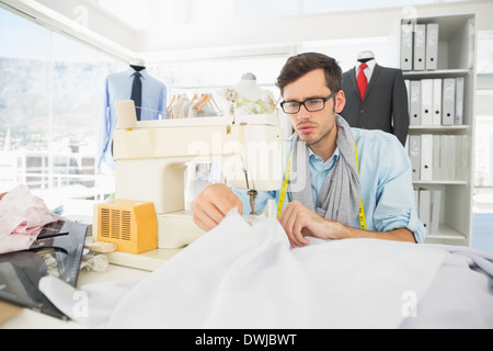 Male tailor sewing in workshop Stock Photo