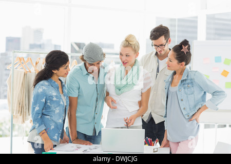 Fashion designers using laptop Stock Photo