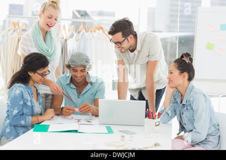 Fashion designers using laptop Stock Photo