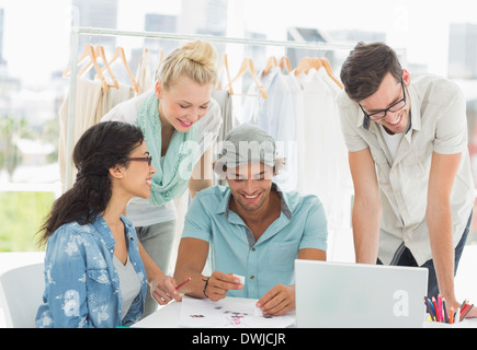 Fashion designers using laptop Stock Photo