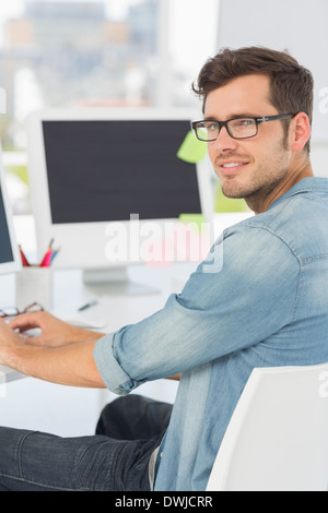 Side view portrait of a male artist using computer Stock Photo