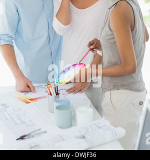 Interior designer showing colour wheel to client Stock Photo