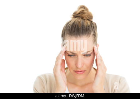 Woman with headache touching her temples Stock Photo