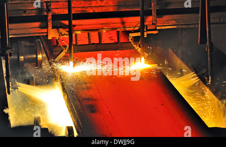 Gas cutting of the hot metal in the plant Stock Photo