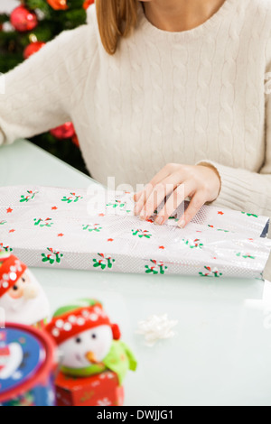 Woman Packing Christmas Present Stock Photo