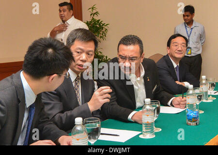 Kuala Lumpur, Malaysia. 10th Mar, 2014. Liao Jinrong (2nd L), chief of the International Cooperation of the Public Security Ministry of China, and acting minister of Malaysian Transport Ministry Hishamuddin Hussein (3rd L) attend a meeting in Kuala Lumpur, capital of Malaysia, March 10, 2014. A delegation of the Public Security Ministry of China and delegates of Malaysian Transport Ministry attended a meeting on the missing Malaysian Airlines flight issue Monday. Credit:  Chong Voon Chung/Xinhua/Alamy Live News Stock Photo