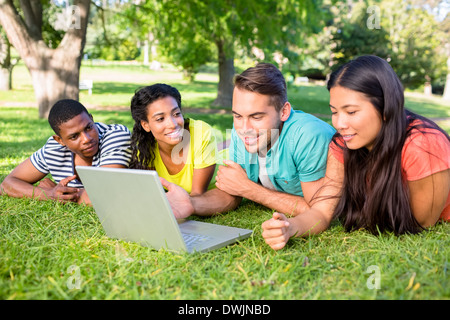 Students using laptop on campus Stock Photo