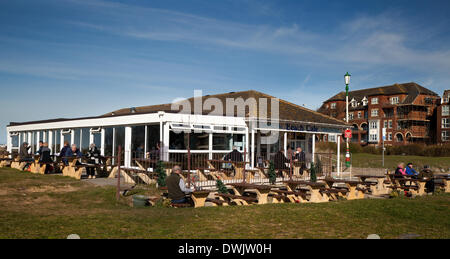 Blackpool, Lancashire, UK. 10th March, 2014. UK Weather. Patrons enjoying the spring sunshine facilitating eating outside at the Beach Terrace Cafe, Lytham St Anne's. The Beach Terrace Café & restaurant take-away catering establishment on South Promenade has probably the finest sea views on the Fylde Coast with seating for up to 170 people when the weather is suitable. Stock Photo