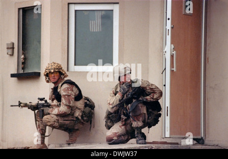 US Navy SEAL commandos arrive at the US Embassy in Kuwait City in a Desert Patrol Vehicle during the liberation of Kuwait City in the Gulf War February 26, 1991 in Southern Iraq. Stock Photo