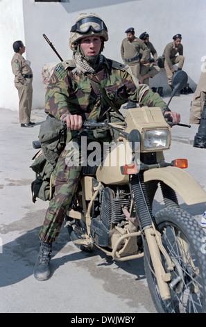 A British army soldier on a motorcycle during the Persian Gulf War February 16, 1991 in Saudi Arabia. Stock Photo