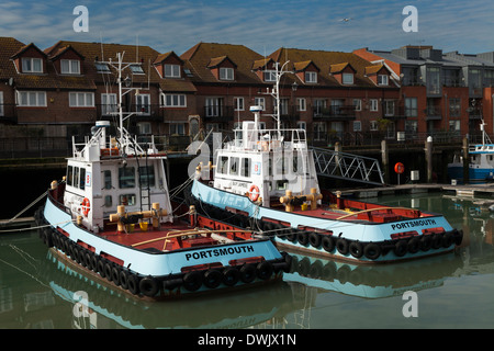 Two Portsmouth tug boats moored in the Harbour. Stock Photo