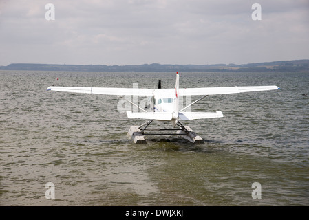 Float plane taking off from a lake New Zealand Stock Photo