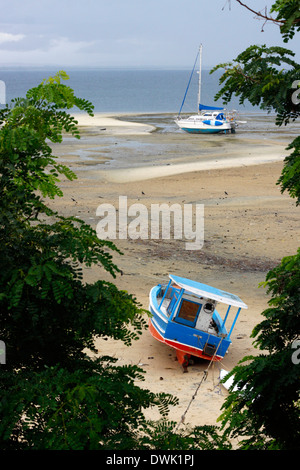 Beached boats on the beach during the low tide, Northern Mozambique. Stock Photo