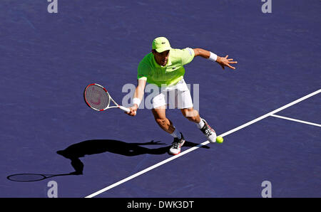 09 March, 2014: Roberto Bautista Agut of Spain returns a shot against Tomas Berdych of the Czech Republic during the BNP Paribas Open at Indian Wells Tennis Garden in Indian Wells CA. Stock Photo