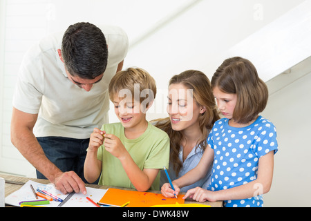 Happy family coloring at home Stock Photo