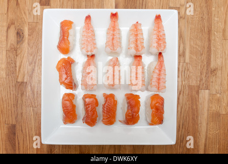 A dish of homemade nigiri sushi, ready to eat. Stock Photo