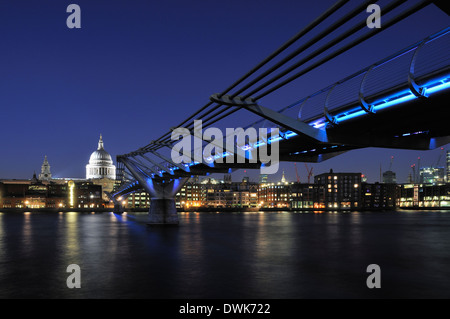 The Millennium Bridge, London UK, at night, with St Paul's Cathedral dome Stock Photo