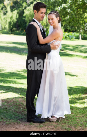 Newly wed couple embracing Stock Photo - Alamy